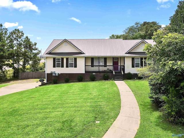 single story home with covered porch and a front yard