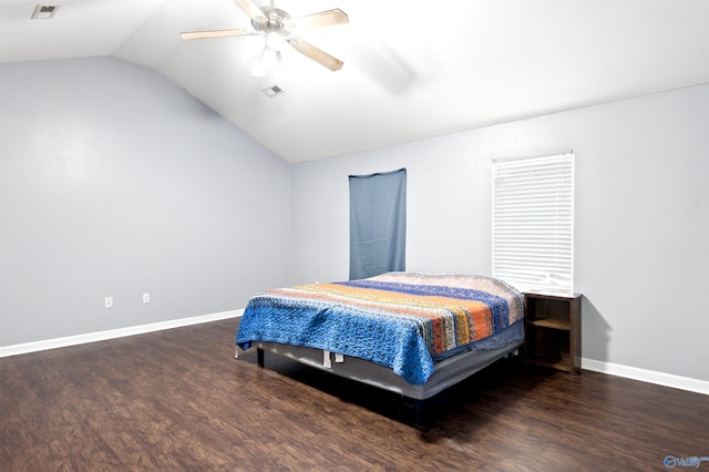 bedroom with lofted ceiling, ceiling fan, and dark wood-type flooring