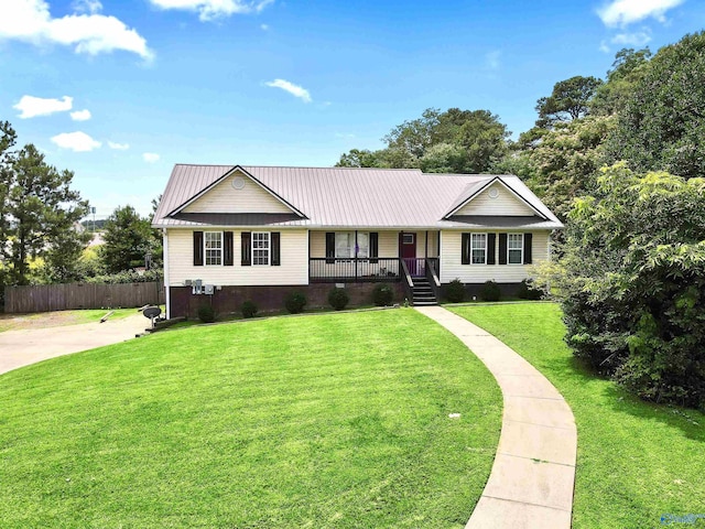 single story home with covered porch and a front yard