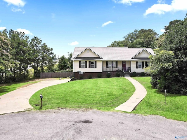 single story home featuring a front lawn and covered porch