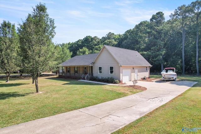 view of front of house featuring a garage, a porch, and a front lawn