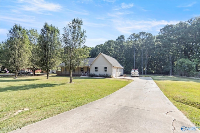 view of front of house featuring a garage and a front lawn