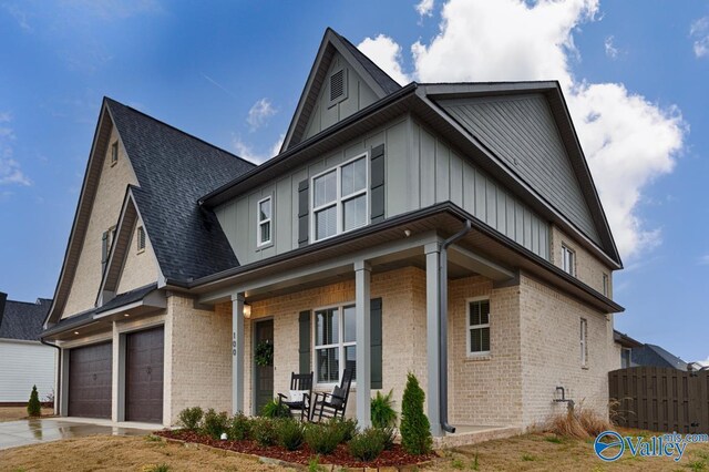 view of front facade with a garage and covered porch