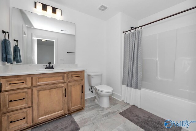 full bathroom with shower / tub combo with curtain, toilet, vanity, and tile patterned floors