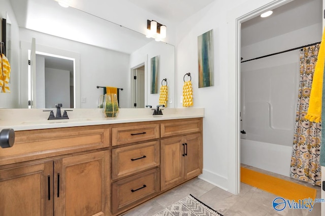 bathroom with tile patterned flooring, vanity, and shower / bath combo with shower curtain