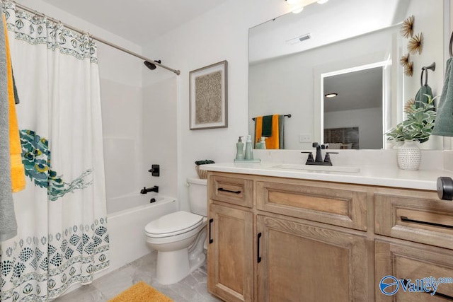 full bathroom with tile patterned floors, vanity, shower / tub combo, and toilet