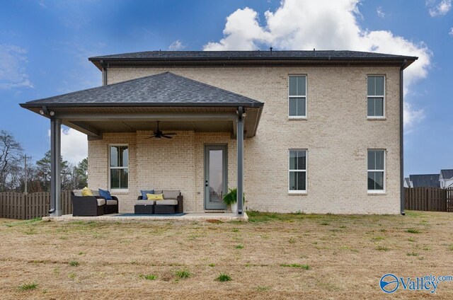 rear view of property featuring ceiling fan, a patio, and outdoor lounge area