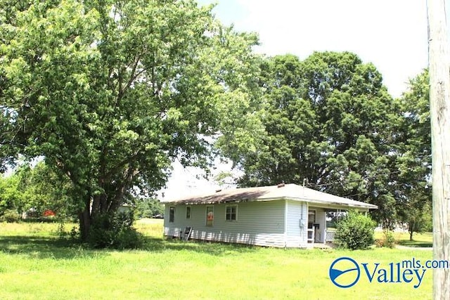 view of home's exterior featuring a lawn