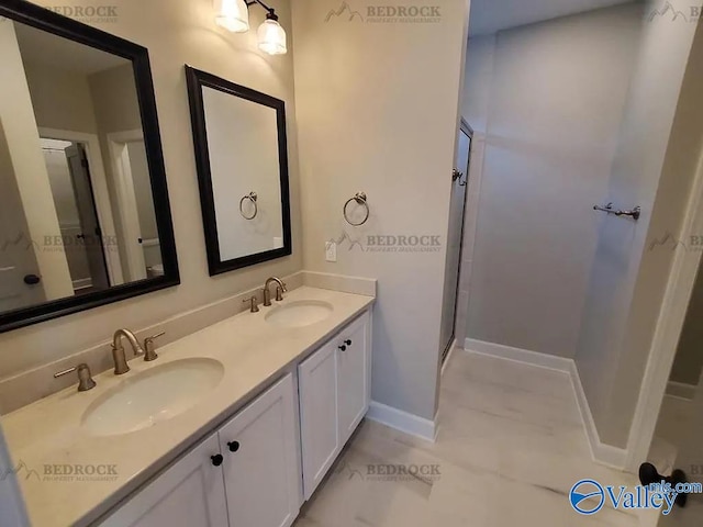 bathroom with an enclosed shower and vanity