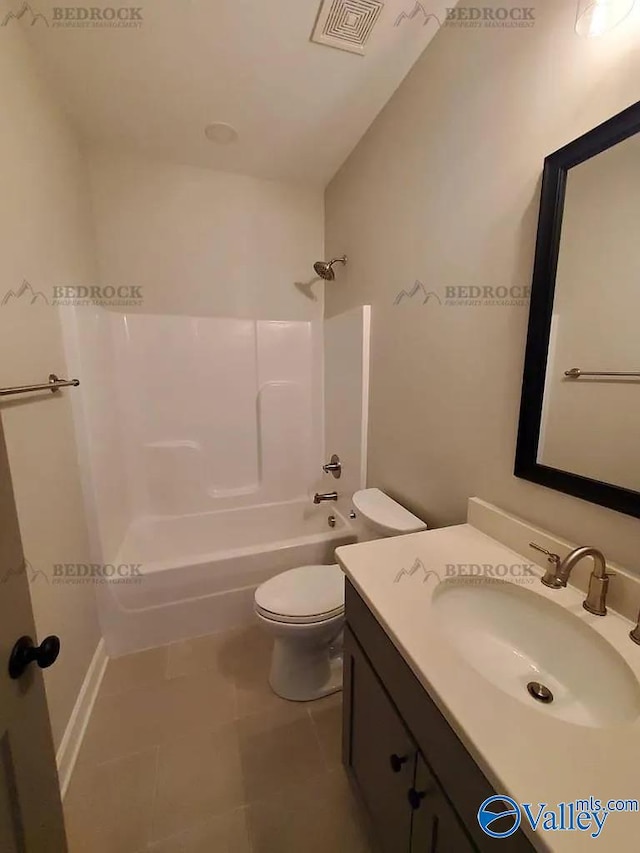 full bathroom with tile patterned floors, shower / washtub combination, vanity, and toilet