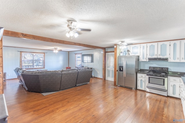 kitchen featuring appliances with stainless steel finishes, light hardwood / wood-style floors, a textured ceiling, white cabinetry, and ceiling fan