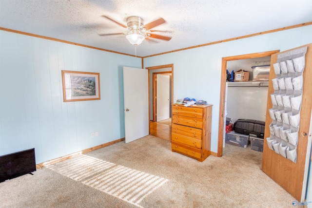 carpeted bedroom featuring a textured ceiling and ceiling fan