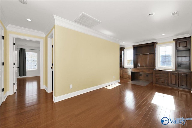 unfurnished living room featuring a wealth of natural light, dark hardwood / wood-style flooring, and ornamental molding