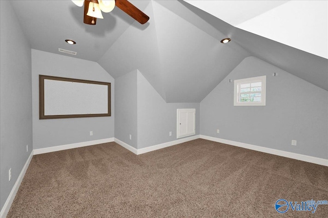 additional living space featuring ceiling fan, carpet floors, and vaulted ceiling