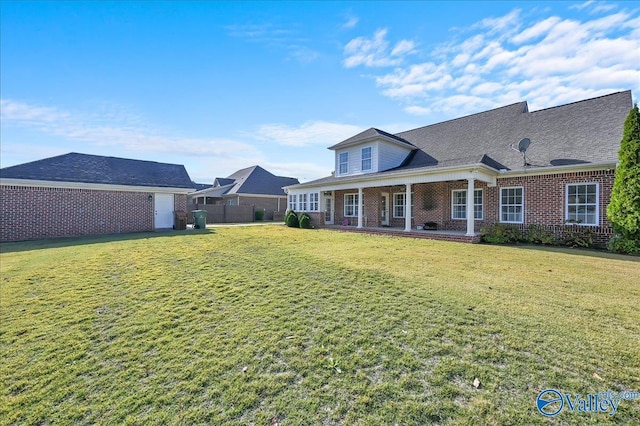 back of house featuring a lawn