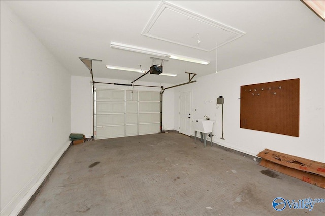 garage with sink and a garage door opener