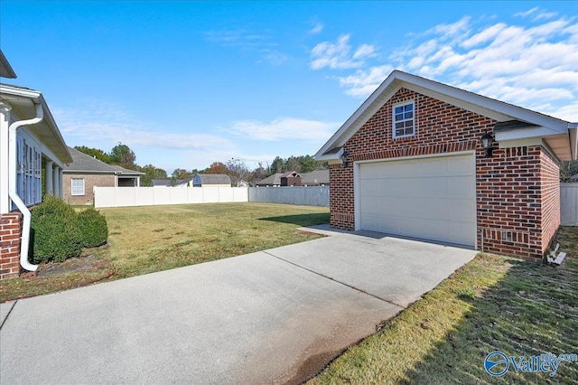 exterior space with a yard and a garage