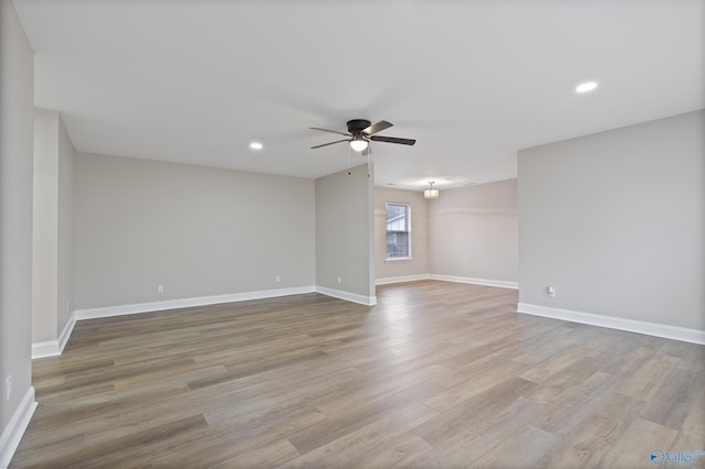 unfurnished room featuring recessed lighting, baseboards, ceiling fan, and wood finished floors