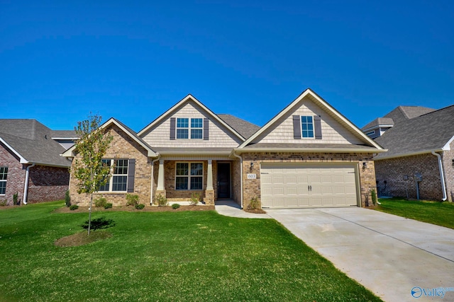 craftsman house with a front lawn and a garage