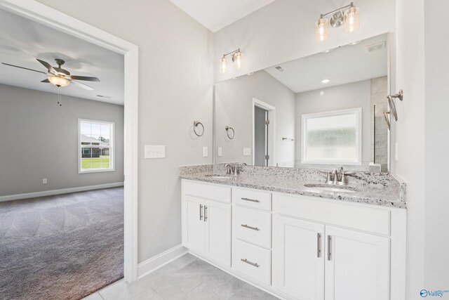 bathroom featuring tile patterned flooring, vanity, and independent shower and bath