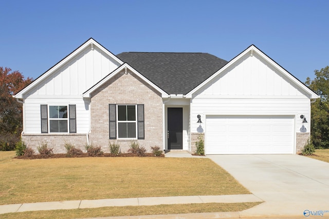 view of front of house featuring a front yard and a garage