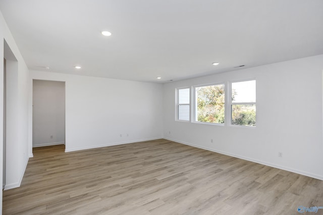 unfurnished room featuring light hardwood / wood-style floors