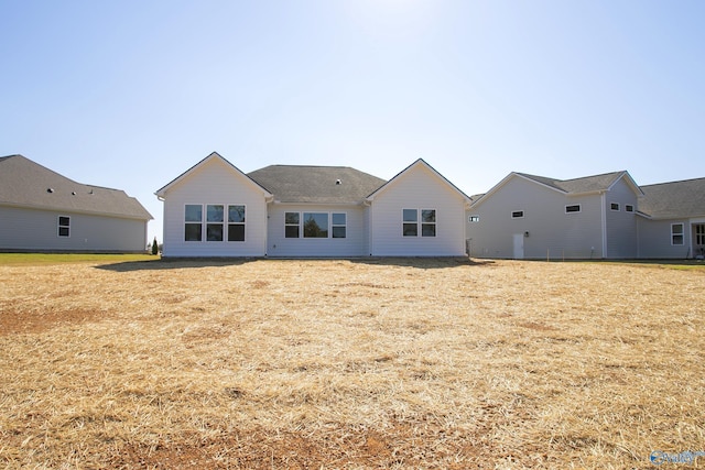 back of house with a yard