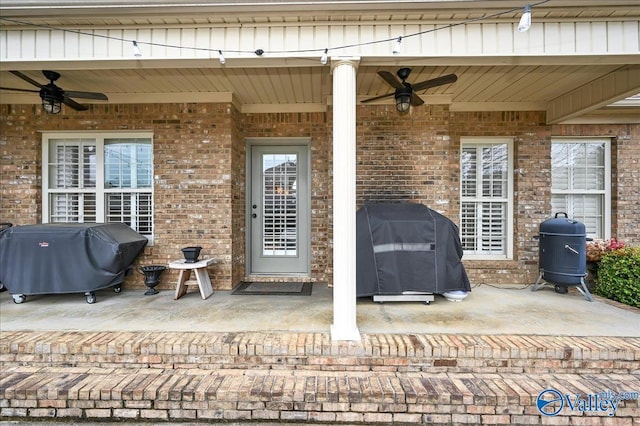 view of patio with ceiling fan and area for grilling