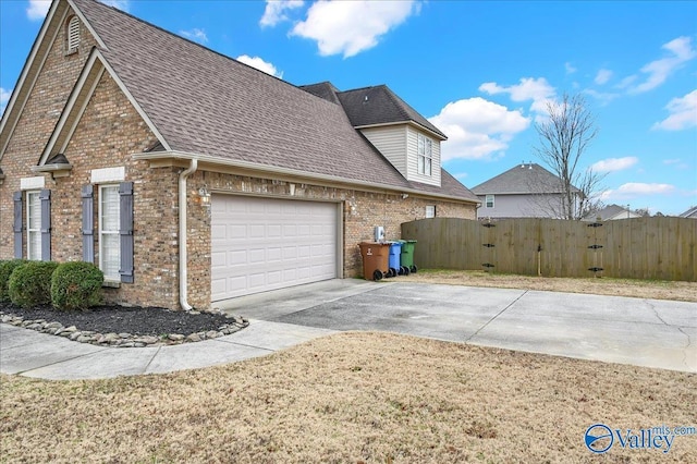 view of side of property with a garage