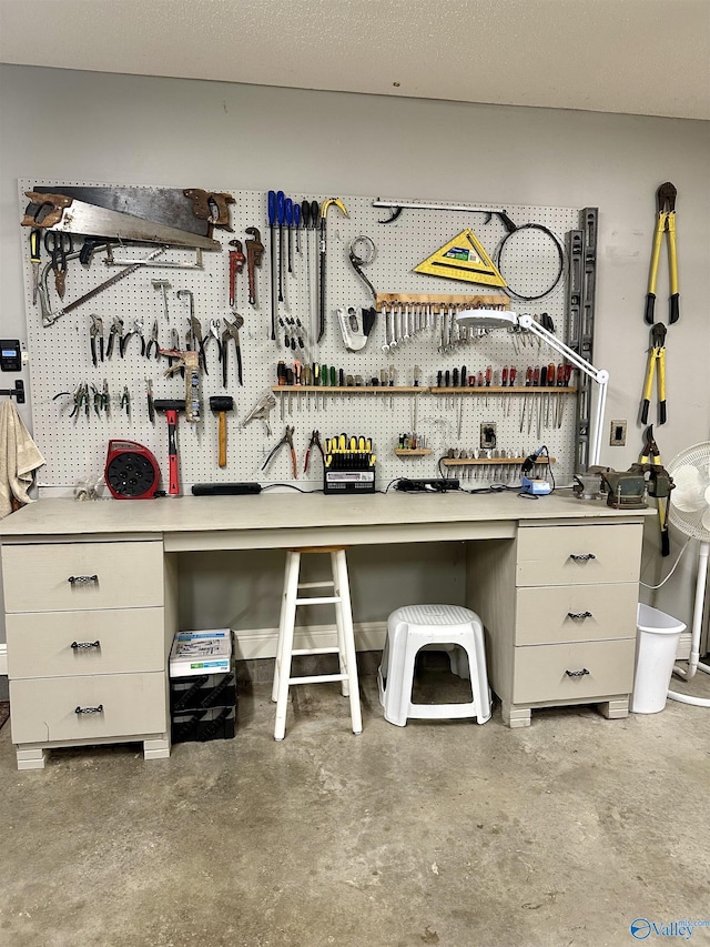 interior space featuring a workshop area and concrete floors