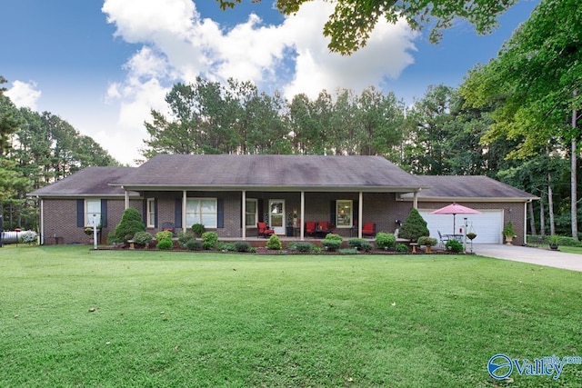 ranch-style house featuring a front lawn, brick siding, a garage, covered porch, and driveway