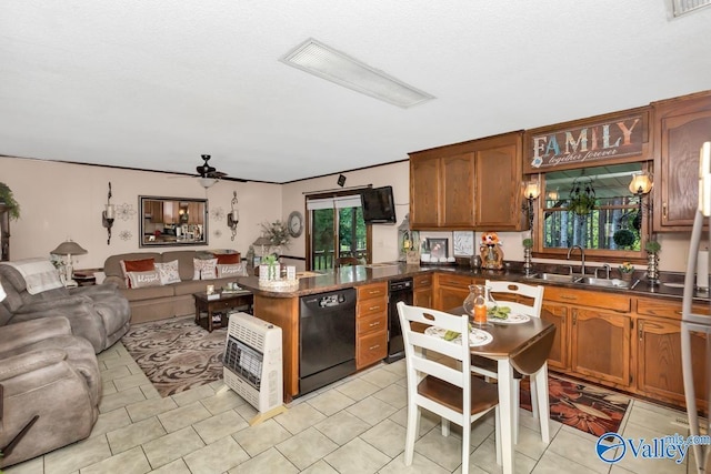 kitchen featuring a sink, black dishwasher, a wealth of natural light, and open floor plan