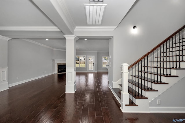 entrance foyer with crown molding and dark hardwood / wood-style floors