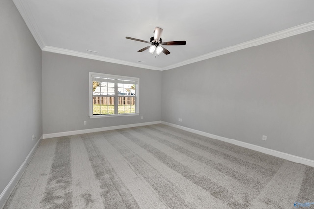 unfurnished room featuring ceiling fan, carpet floors, and ornamental molding