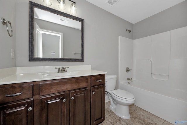 full bathroom featuring tile patterned flooring, vanity, toilet, and bathing tub / shower combination