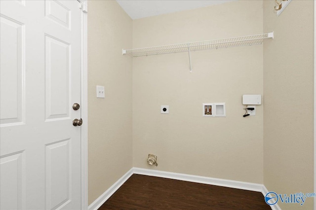 clothes washing area featuring laundry area, washer hookup, baseboards, dark wood finished floors, and electric dryer hookup