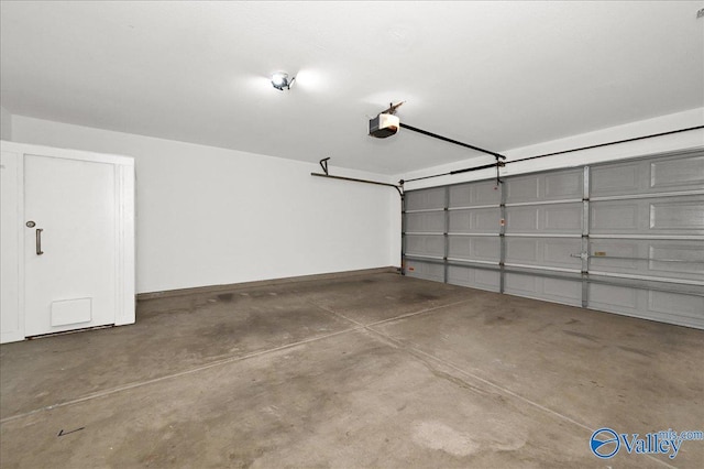 garage featuring baseboards and a garage door opener