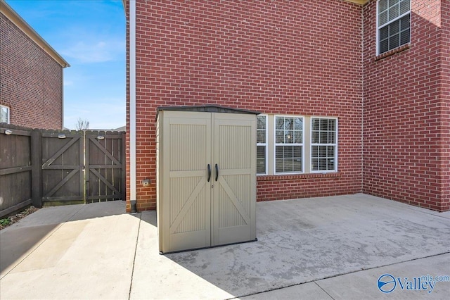 exterior space featuring fence and a gate