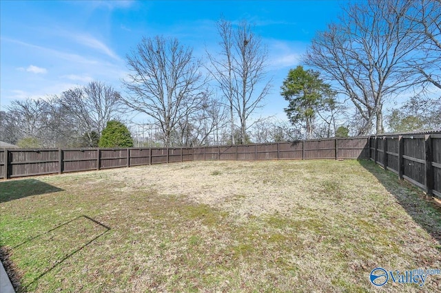 view of yard with a fenced backyard