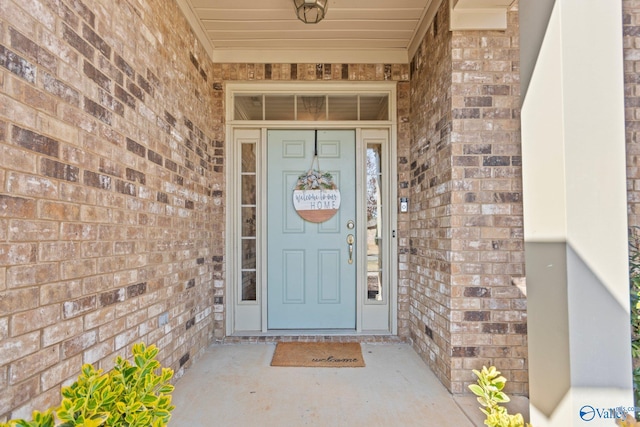 property entrance with brick siding
