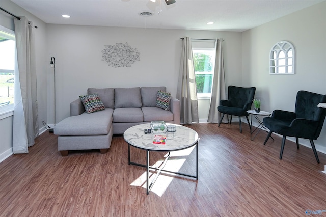 living area with visible vents, baseboards, ceiling fan, wood finished floors, and recessed lighting