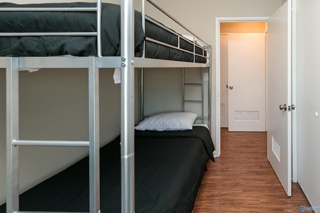 bedroom with wood finished floors