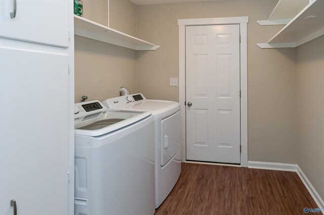 laundry room featuring laundry area, washer and clothes dryer, dark wood finished floors, and baseboards