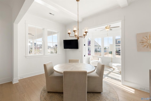 dining room featuring ceiling fan with notable chandelier and light wood-type flooring