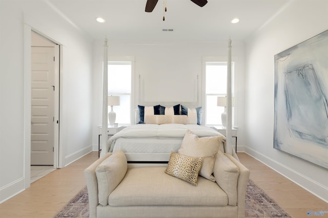 bedroom featuring ceiling fan and light hardwood / wood-style flooring