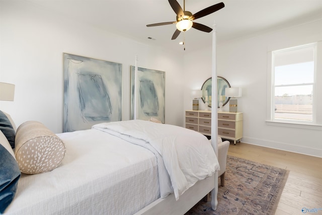 bedroom featuring hardwood / wood-style floors and ceiling fan