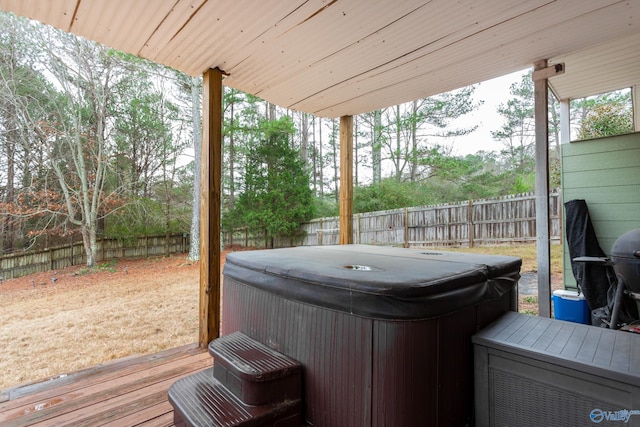 deck featuring a hot tub