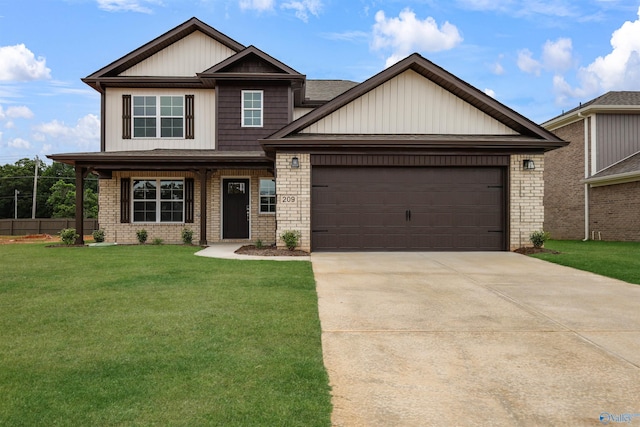209 Roman Randall Rd, New Market, AL 35761 - craftsman inspired home with brick siding, a front lawn, a garage, and driveway