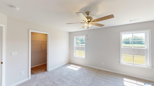 209 Roman Randall Rd, New Market, AL 35761 - unfurnished bedroom with a closet, baseboards, visible vents, a walk in closet, and carpet flooring