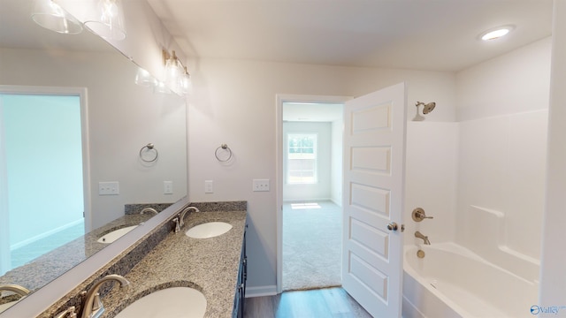 209 Roman Randall Rd, New Market, AL 35761 - full bath with shower / bath combination, a sink, and wood finished floors